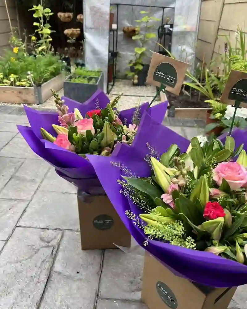 Hand-tied seasonal bouquets in BloomHaus wrapping
